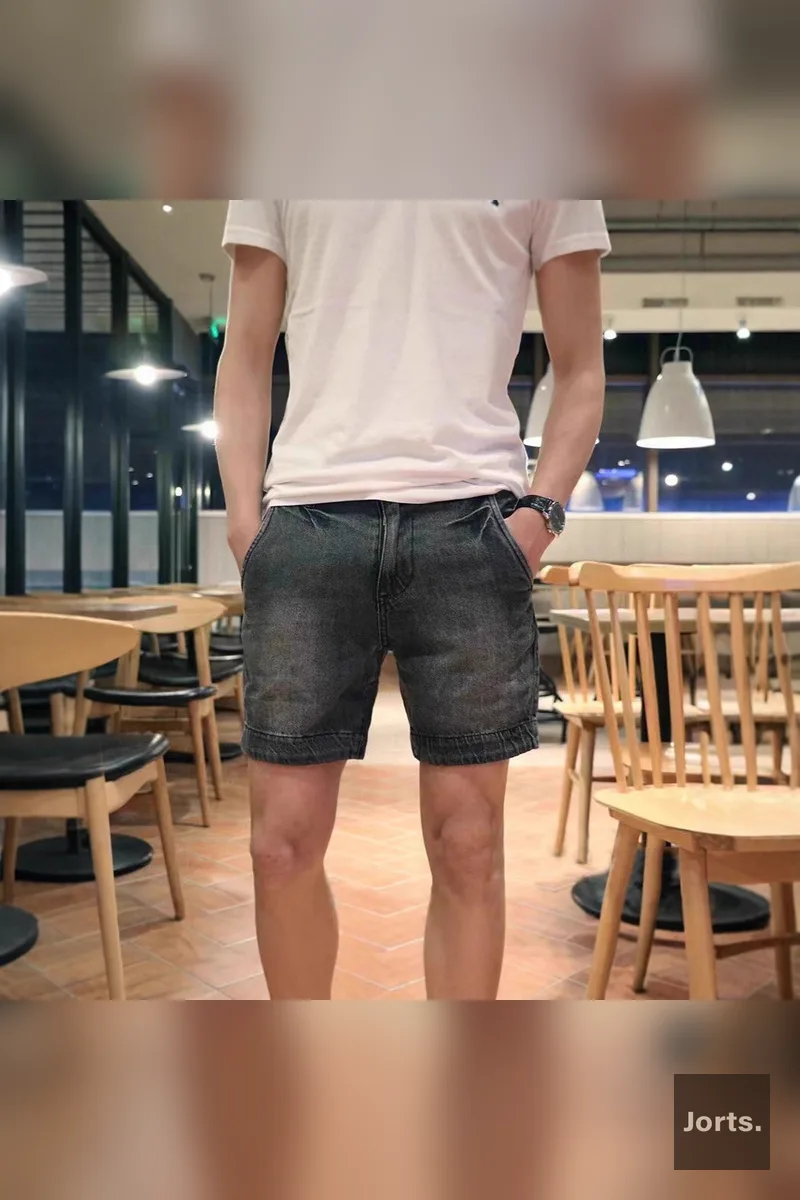 Mens relaxed fit light blue denim jorts, front view worn by model